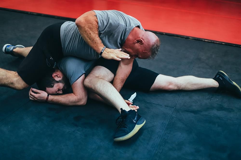 Ground-defense drill against an edged-weapon attack