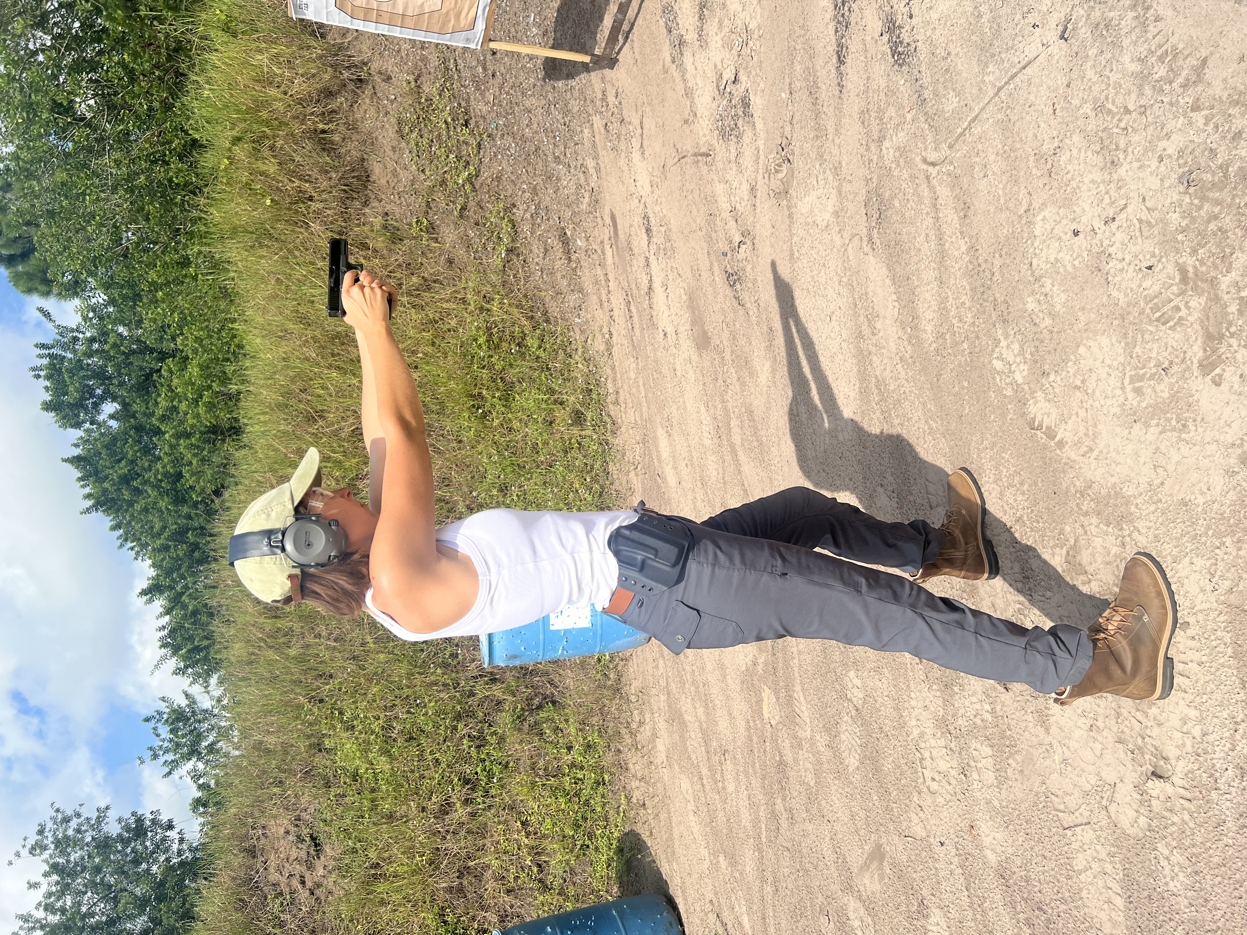 Student practicing pistol fundamentals on the range